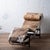 An LC4 style chaise lounge chair in cowhide. 64 inches wide by 23 inches deep by 28 inches tall