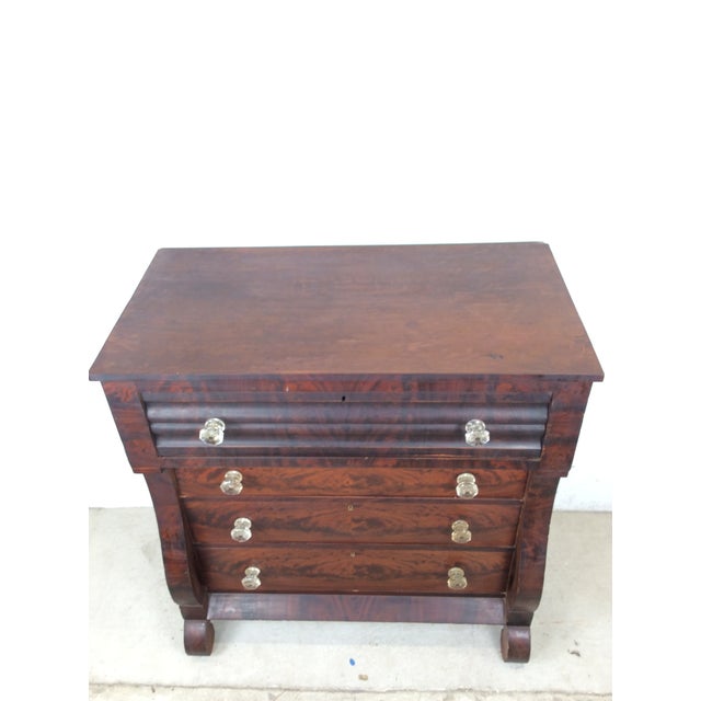 This antique chest of drawers features hardwood construction, four dovetailed drawers with large glass hardware, beautiful...