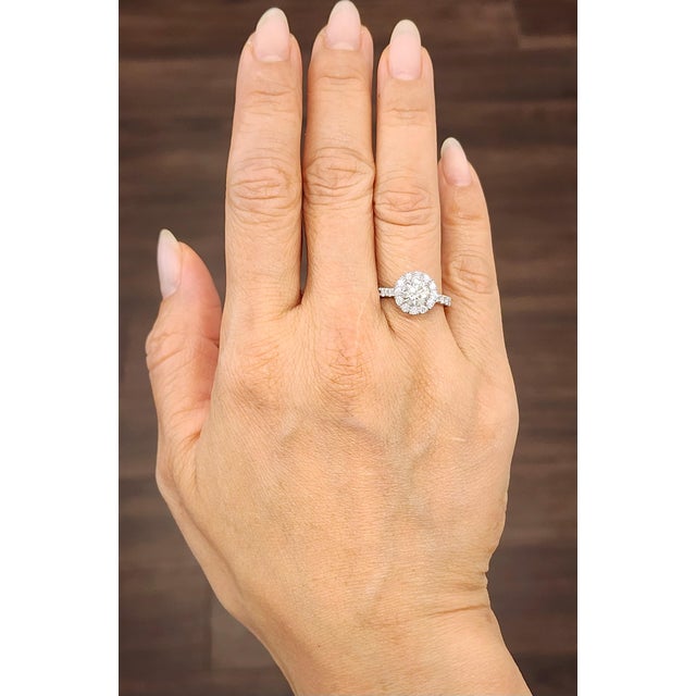 A stunning 1.01-carat diamond takes center stage, exhibiting its H/I color and VS1/VS2 clarity. The 25 diamonds...