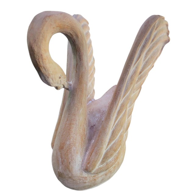 A beautiful vintage ceramic sculpture swan side table. The swan is made of a ceramic or sculpture material with a sort of...