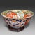 A striking Japanese Arita Imari porcelain bowl dating to the Edo period, distinguished by its large proportions and...