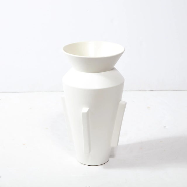 This refined modernist urn form vase was realized in the United States during the latter half of the 20th century. It...