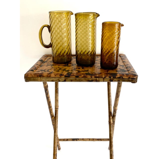 Part of a fabulous capsule collection of Mid-century handblown amber glassware including small serving bowls, various...