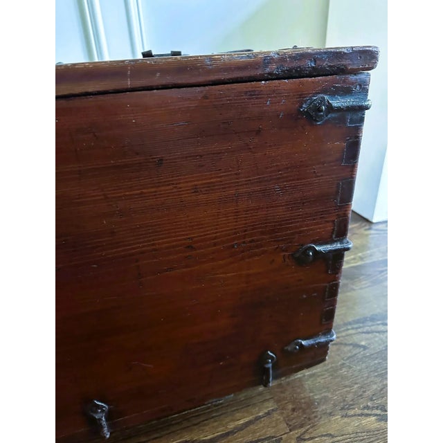 A large Korean top-lid chest on block feet circa 19th century of Joseon Dynasty. Known as coin chest (Ton-Kwe in Korean),...