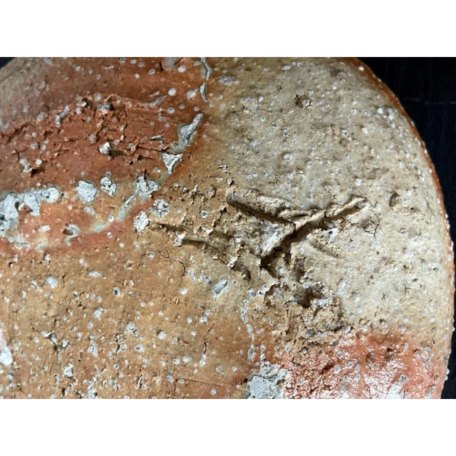 A contemporary Stoneware Bowl made in the tradition of Iga ware by Japanese ceramic artist Shiro Tsujimura (1947-). In a...