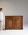 Carved oak sideboard in Honey Oak. Its honey oak finish sets off two paneled doors, two drawers, relief-carved detailing,...