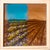 This oil on panel artwork presents a serene landscape of lavender fields, with vibrant blooms contrasting against earthy...