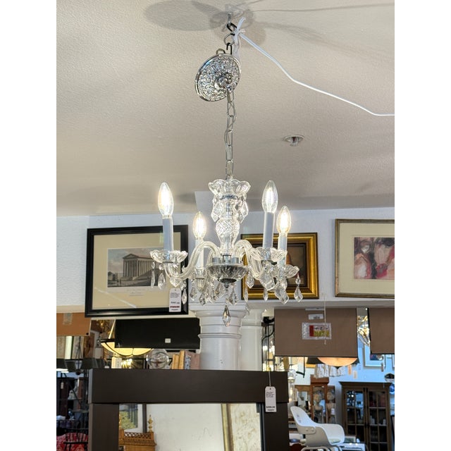 Design Plus Gallery presents a Vintage Crystal Chandelier. This traditional fixture showcases four gracefully curved glass...