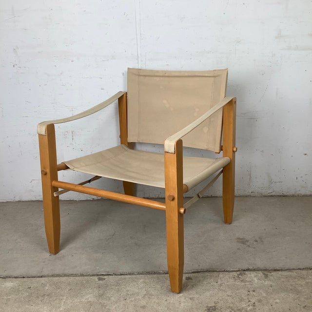 Inspired by the enduring appeal of classic Scandinavian safari furniture, this vintage lounge chair embodies the clean...