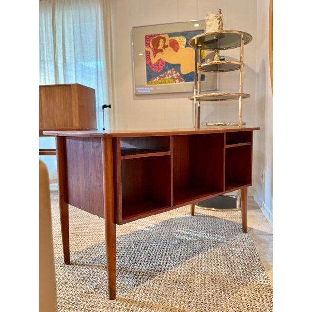 Beautiful mid century modern front facing desk, circa 1960s. Constructed from rich teak with a warm, natural finish, the...