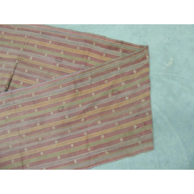 Vintage Asian Tent Banners With Hand-Knotted Fringes. Woven cotton stripes pattern textile in shades of Rust, green, red...