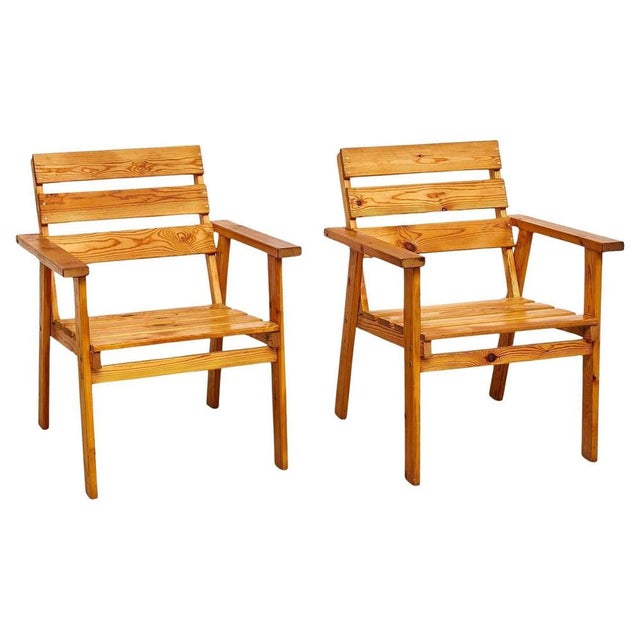 Step into the elegance of mid-century design with this stunning pair of armchairs, a true embodiment of the Rationalist...