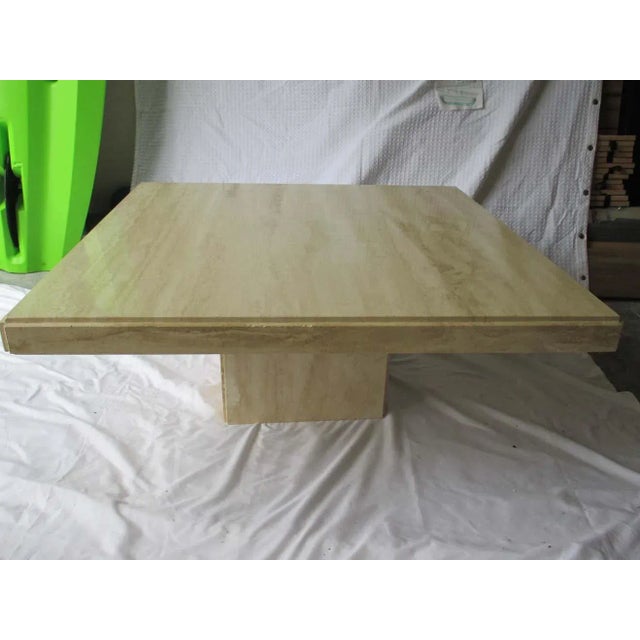 Beautiful Italian Travertine coffee table with top that lifts off base. Classic!