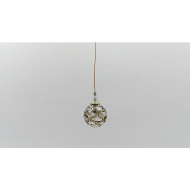 Lovely petit space age opal glass hanging lamp with chrome, 1960s germany executed in opaline glas and chrome. the lamp...