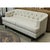 This sofa features a curved, wraparound back that creates a cozy, enclosed silhouette. The tufted detailing adds a...