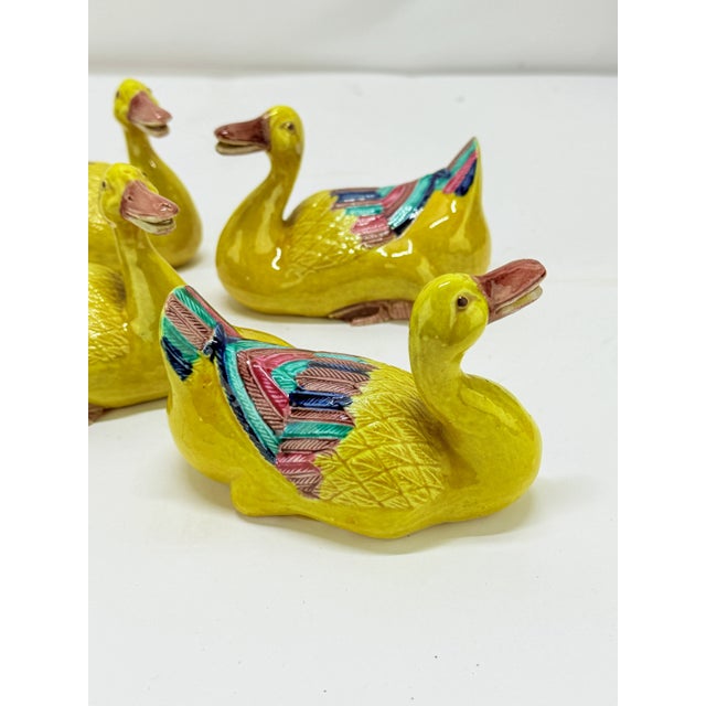 A set of four Chinese Export famille jaune porcelain duck-form brush rests, dating to the late 19th to early 20th century,...