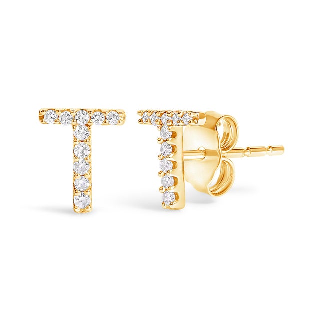 Expertly crafted to symbolize individuality and grace, this exquisite "T" initial stud earring is fashioned from radiant...