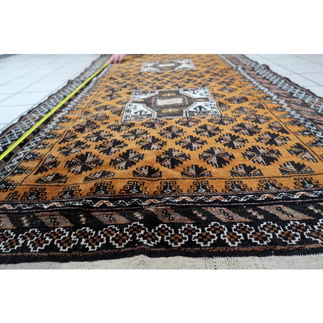 Handmade Antique Afghan Baluch Rug: Indulge in the timeless allure of our Handmade Antique Afghan Baluch Rug, meticulously...
