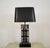 Vintage 1950's Mid century Modern table lamp for sale. It's made of solid rosewood, and has solid brass accent brackets on...