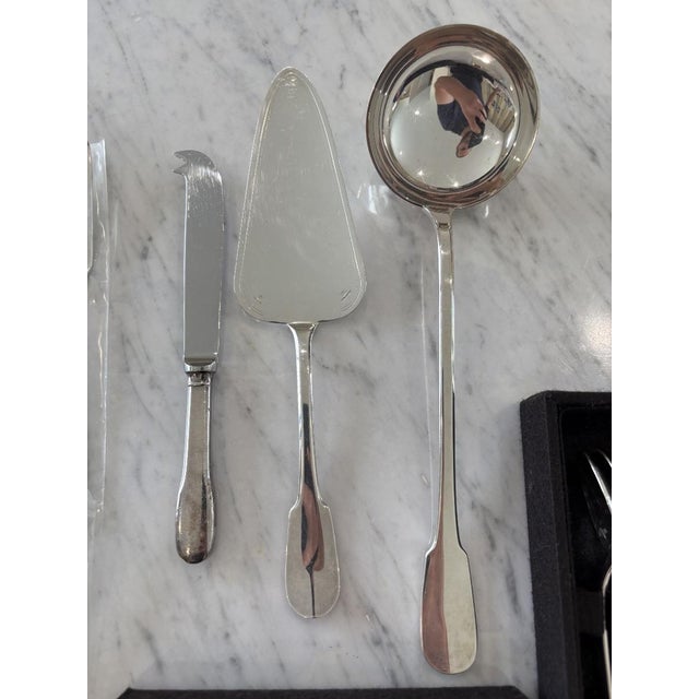 87-piece Christofle silver-plated flatware set comprising: 12 dinner knives 12 dinner forks 12 dinner spoons 12 fish forks...