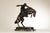 High Quality Cast Bronze Sculpture of Cowboy on Horseback After Frederick Remington (American, 1861-1909), Signed