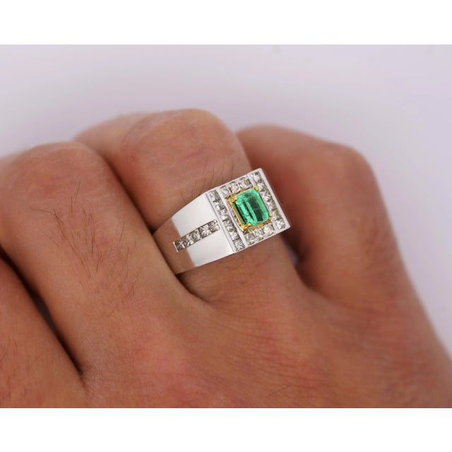 Natural 0.77 Carat Emerald and 1.01 Carat Diamond 18K Gold Mens Ring Mens Ring boasting an emerald-cut, vivid green...