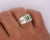 Natural 0.77 Carat Emerald and 1.01 Carat Diamond 18K Gold Mens Ring Mens Ring boasting an emerald-cut, vivid green...