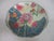 A decorative porcelain Asian plate. It is hand painted decorated with the Tobacco Leaf pattern, in colors of rose, blue...