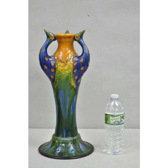 Vintage Art Nouveau Majolica Style Glazed Ceramic Pottery Peacock Bird Vase. Circa Mid 20th Century. Measurements: 16.5" H...