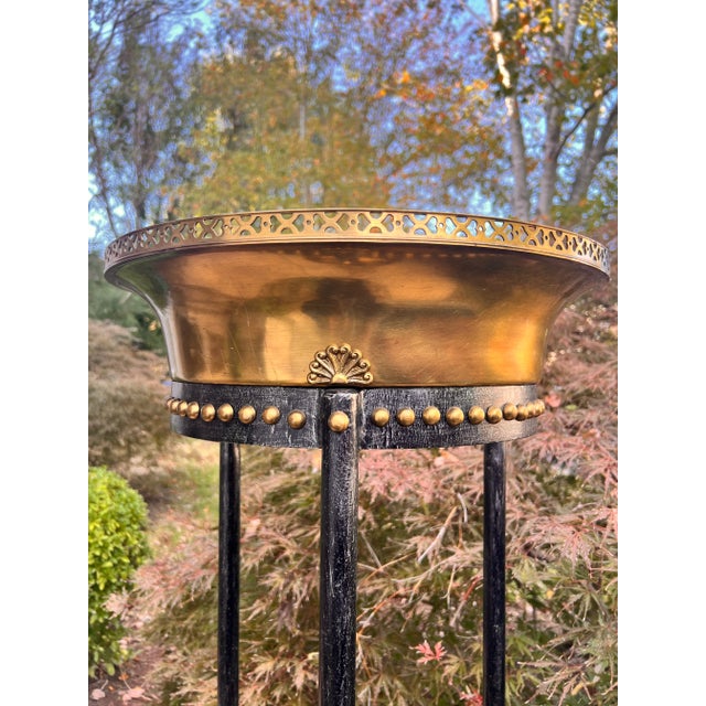 This elegant vintage plant stand by Theodore Alexander is in very good vintage condition. The combination of wrought iron...