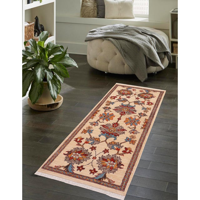 Enhance the ambiance of your home with this magnificent Persian-influenced Turkish hand-knotted rug made by skilled...
