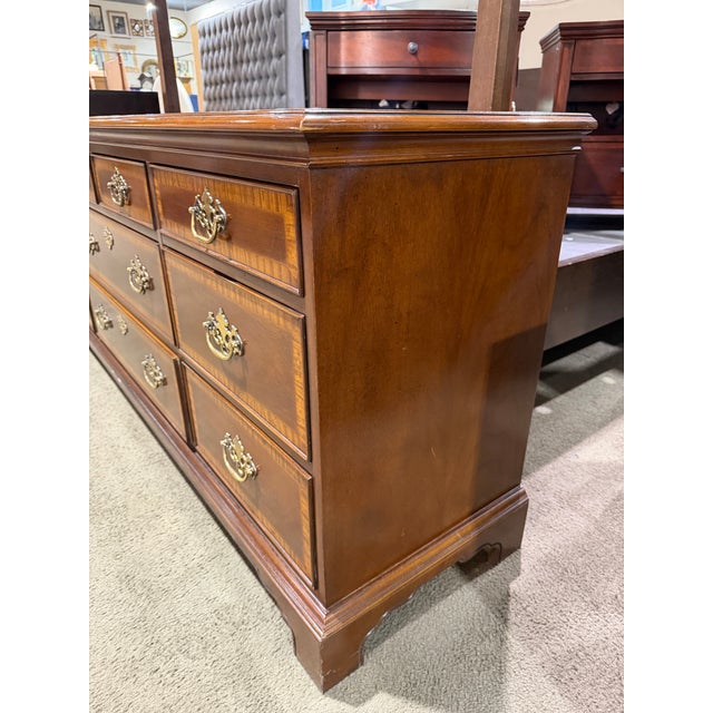 A masterclass in traditional craftsmanship, this Drexel Heritage dresser from the esteemed “18th Century Collection”...