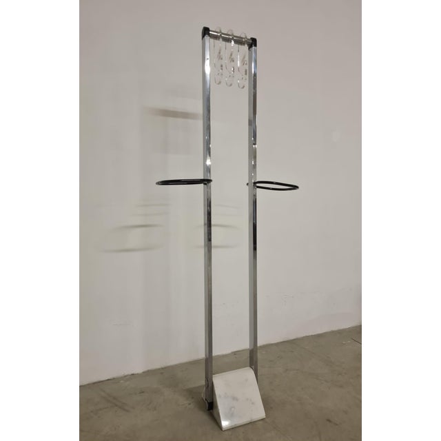 70's coat hanger, Space Age. Elegant Italian design coat stand. The coat rack features a white marble base with steel...