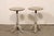 An American-made pair of painted, round pedestal side tables. These vintage smaller-sized tables each feature a `17.75...