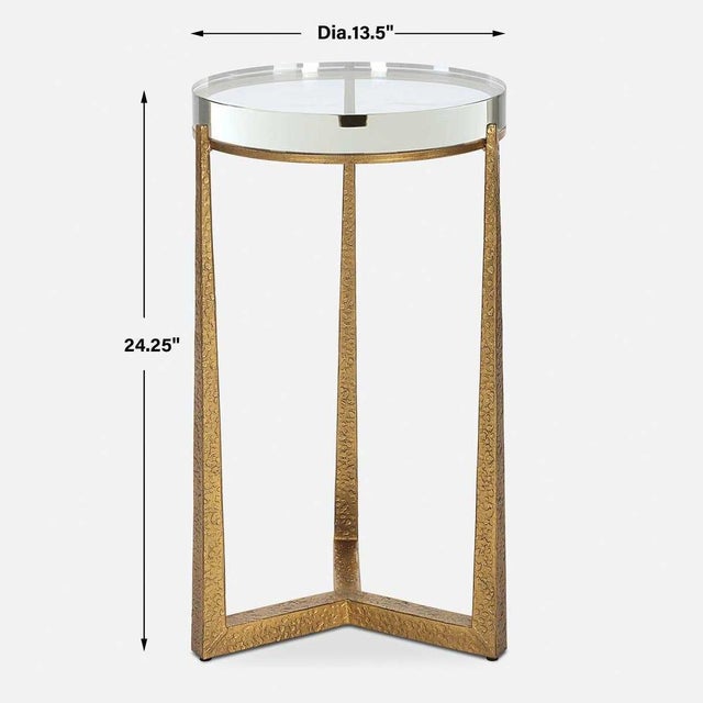 This Cool gold glam accent table adds a touch of luxury to any room. The textured antique gold finished iron legs...