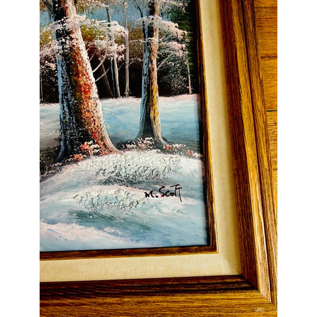 Original signed oil painting depicting a winter mountain landscape with snow-covered evergreens, a winding river, and...