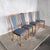 a refined set of four danish dining chairs by skovby, dating from the 1970s. Their sculptural high backs, warm teak and...