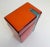 Vibrant shades of red, orange, and blue in this ceramic lidded storage canister / box. Likely produced in West Germany...
