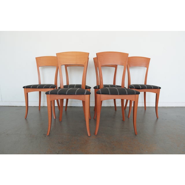 These vintage A. Sibau dining chairs embody refined Italian modern design with their gracefully curved backs, sculpted...
