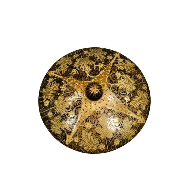 A lovely round papier mâché box that has been hand painted with a gold oak leaf design. The top has a finial. The interior...