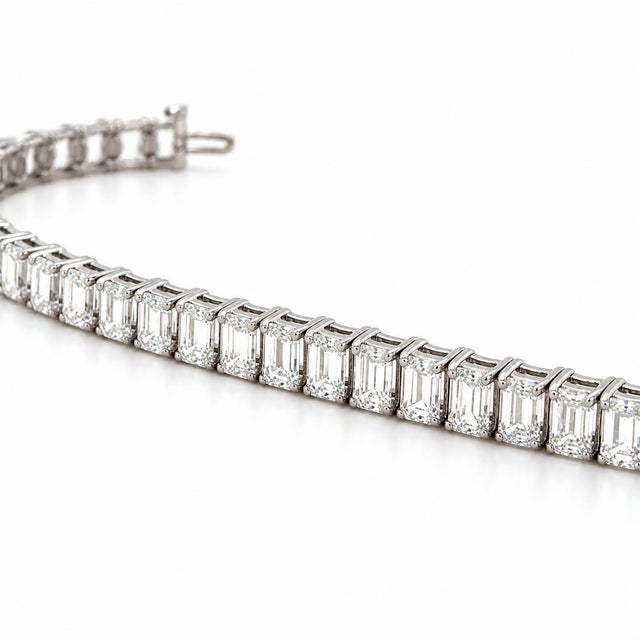 This stunning bracelet contains 39 emerald cut diamonds weighing 19.67 carats total, each with a GIA certificate. Crafted...