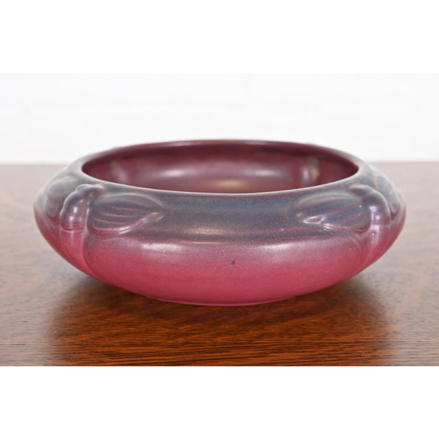 A gorgeous Arts & Crafts period mulberry glazed ceramic art pottery shallow bowl with dragonfly motif By Van Briggle...