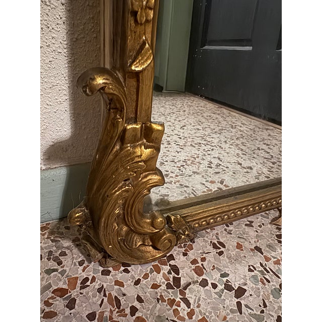 A romantic French Louis XVI style trumeau mirror with all the classical neoclassical motifs: a graceful tied ribbon (nœud...