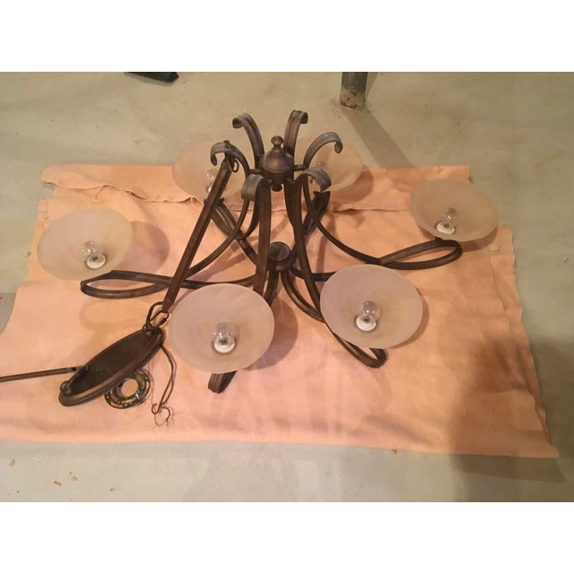 Lovely Manor style oil-rubbed bronze scrolled chandelier with 6 arms and 6 alabaster shades, 43” long by 26” wide by 19”...