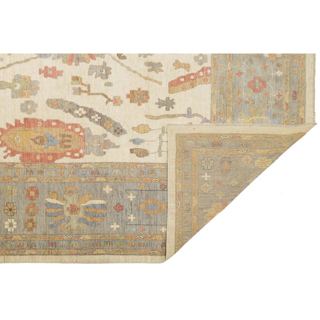 This stunning Modern Oushak style rug blends traditional Turkish heritage with a fresh, contemporary aesthetic. Hand-...