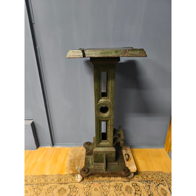 This cast iron “pedestal” was either the leg of an old machine or the lower part of a candelabra, to which we attached a...