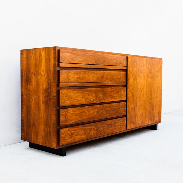 A remarkable mid century modern walnut credenza by Widdicomb, with grain patterns so figured it almost resembles rosewood....