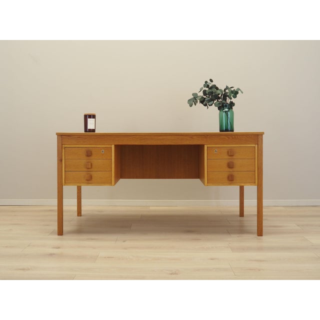 The desk was made in the 1970s, produced by the well-known Danish manufactory Domino Møbler. The structure and the top of...