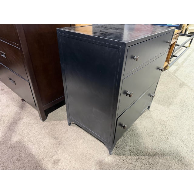 Introduce a bold, industrial edge to your bedroom with the Four Hands “Belmont” Nightstand by Four Hands—a striking...