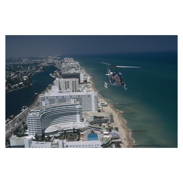 Aerial Miami Beach 1972 A helicopter carrying tourists hovers over the Fontainebleau Hotel on Miami Beach, Florida, April...